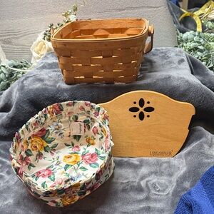 Longaberger 7x4 bread basket with divider and floral cloth insert.